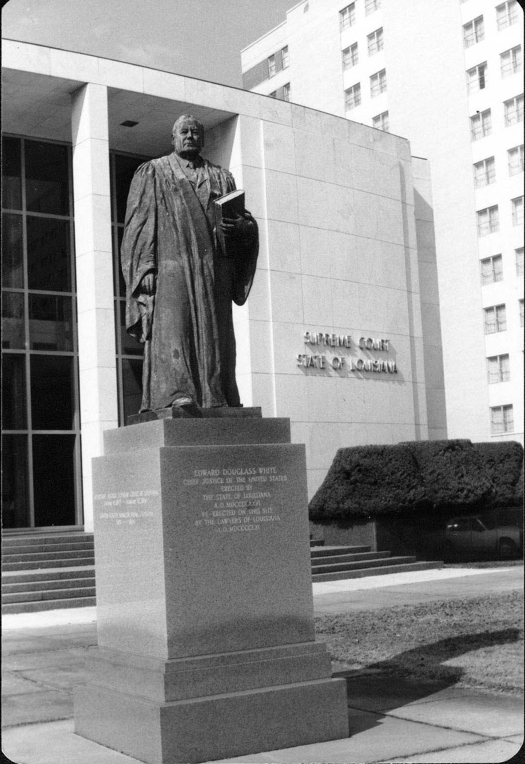 Panoramic image of Louisiana Supreme Court building with statue of